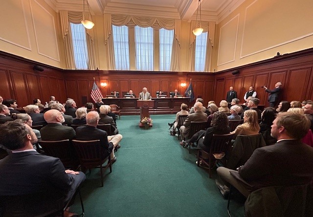 Emcee Tom Anderson addresses the crowd of well-wishers